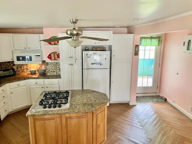 3250 Colona St, Chincoteague, VA 23336 - kitchen with white appliances, tasteful backsplash, white cabinets, a center island, and ornamental molding