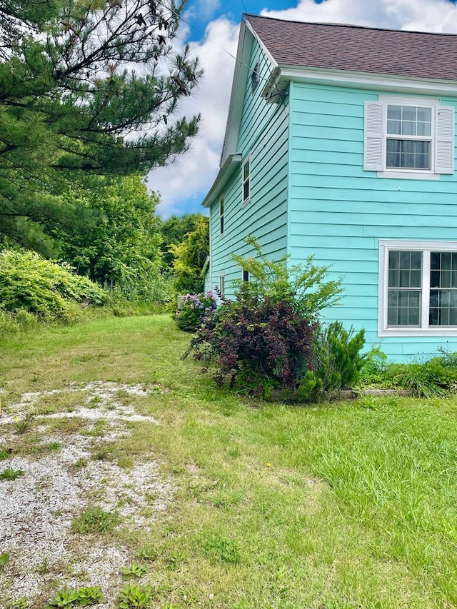 3250 Colona St, Chincoteague, VA 23336 - view of side of home with a shingled roof
