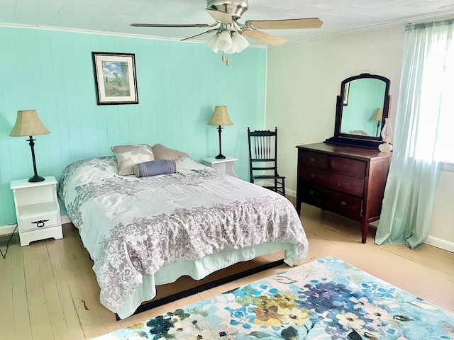 3250 Colona St, Chincoteague, VA 23336 - bedroom with crown molding, wood finished floors, baseboards, and ceiling fan