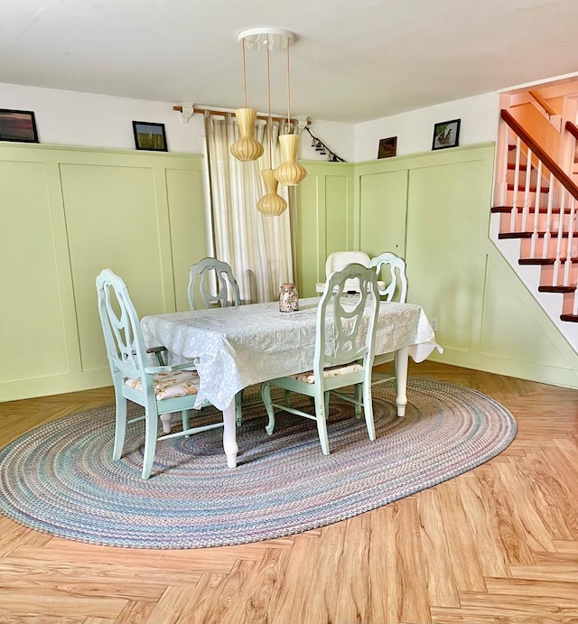 3250 Colona St, Chincoteague, VA 23336 - dining space featuring a decorative wall and stairway