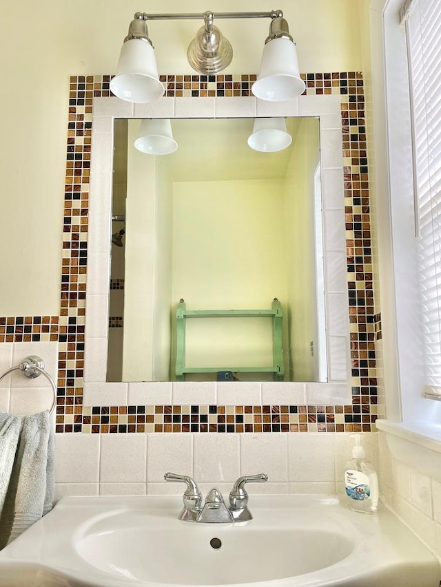 3250 Colona St, Chincoteague, VA 23336 - bathroom featuring a sink, backsplash, and tile walls