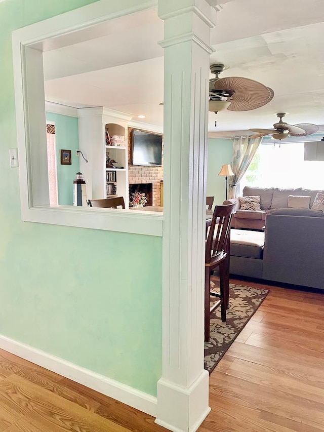3250 Colona St, Chincoteague, VA 23336 - kitchen with ceiling fan, wood finished floors, ornate columns, and open floor plan