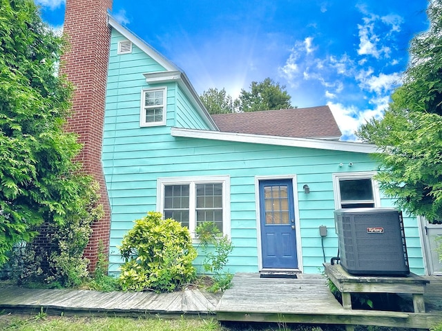 3250 Colona St, Chincoteague, VA 23336 - view of front facade featuring a chimney