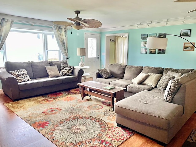3250 Colona St, Chincoteague, VA 23336 - living area featuring ceiling fan, wood finished floors, and track lighting