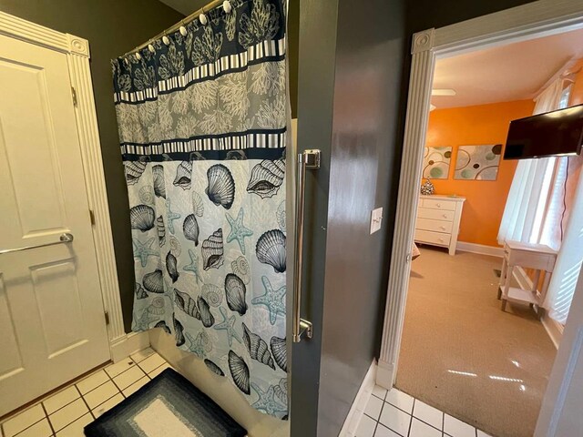 405 Randolph Ave, Cape Charles, VA 23310 - bathroom with a shower with curtain, tile patterned flooring, and baseboards