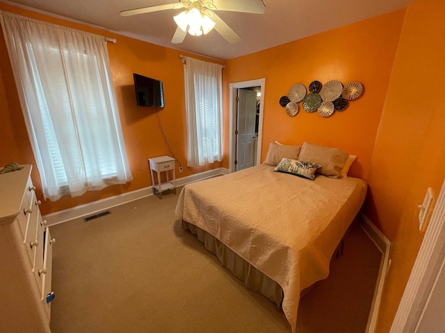 405 Randolph Ave, Cape Charles, VA 23310 - bedroom featuring baseboards, visible vents, a ceiling fan, and carpet flooring