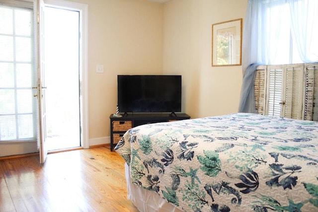 405 Randolph Ave, Cape Charles, VA 23310 - bedroom with baseboards and wood finished floors