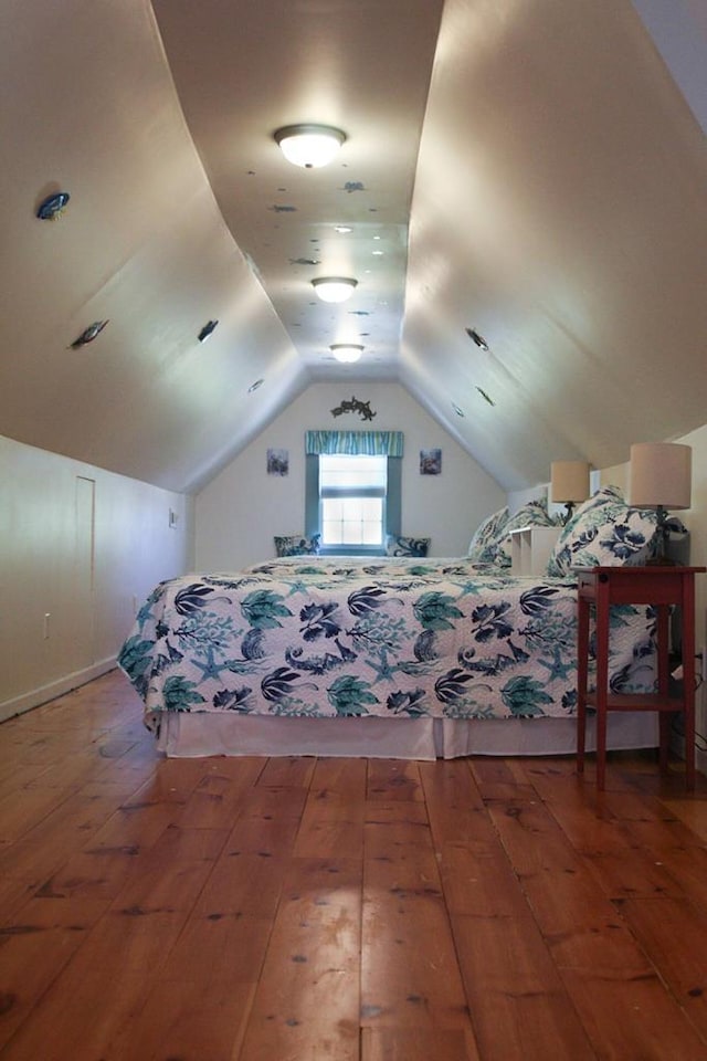 405 Randolph Ave, Cape Charles, VA 23310 - bedroom featuring vaulted ceiling and wood-type flooring