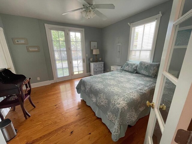 405 Randolph Ave, Cape Charles, VA 23310 - bedroom featuring light wood-style floors, access to outside, baseboards, and a ceiling fan