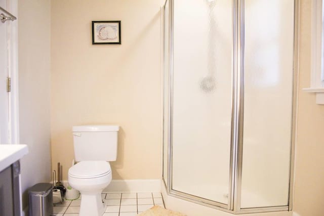 405 Randolph Ave, Cape Charles, VA 23310 - bathroom featuring baseboards, toilet, tile patterned flooring, vanity, and a shower stall