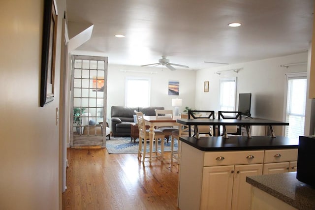 405 Randolph Ave, Cape Charles, VA 23310 - kitchen featuring light wood finished floors, dark countertops, a ceiling fan, and recessed lighting