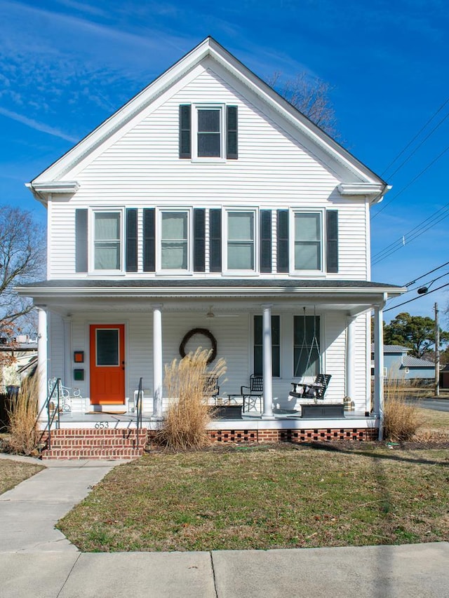 front facade featuring a front yard and a porch