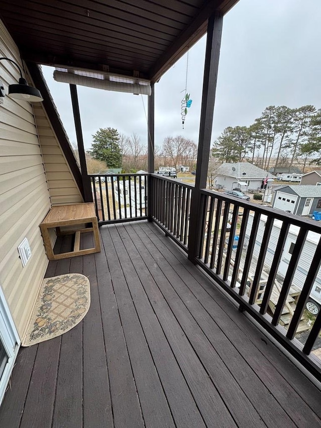 wooden deck with a residential view