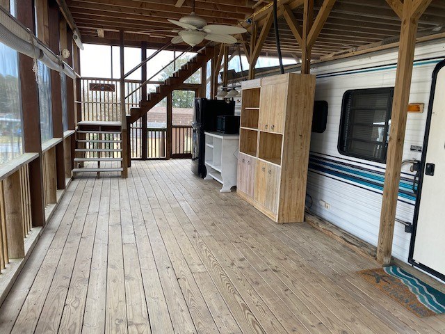 wooden terrace featuring stairway