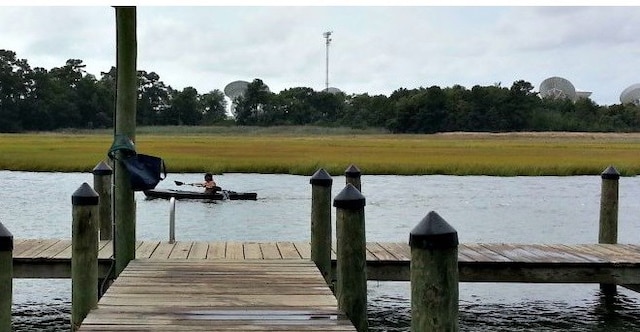 dock area featuring a water view