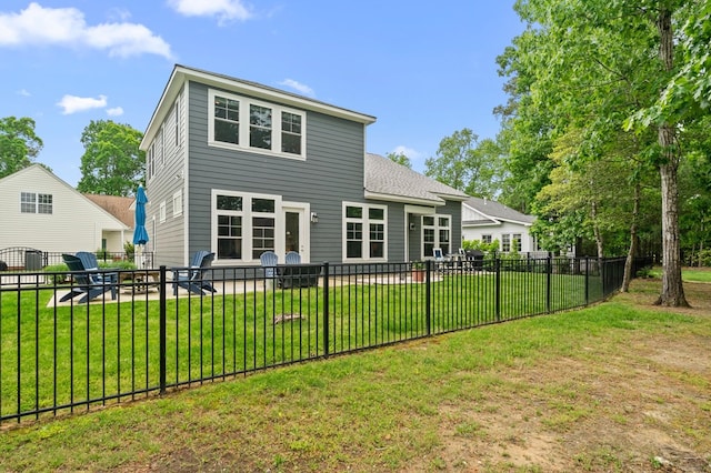 8 Perny Ct, Cape Charles, VA 23310 - back of house with fence, a shingled roof, and a lawn