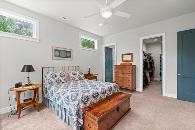 8 Perny Ct, Cape Charles, VA 23310 - bedroom with a closet, visible vents, light carpet, a walk in closet, and baseboards