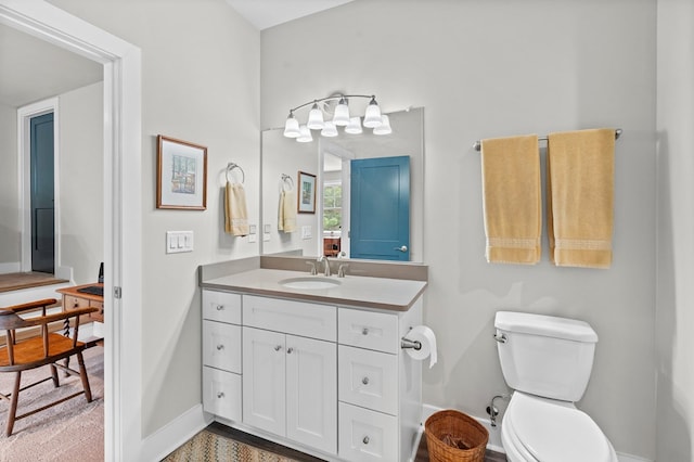 8 Perny Ct, Cape Charles, VA 23310 - bathroom featuring vanity, toilet, and baseboards