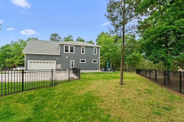 8 Perny Ct, Cape Charles, VA 23310 - rear view of house with a lawn, driveway, roof with shingles, and fence