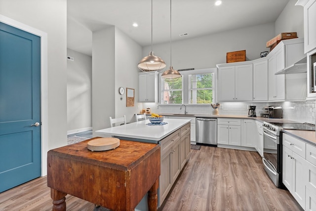 8 Perny Ct, Cape Charles, VA 23310 - kitchen featuring recessed lighting, appliances with stainless steel finishes, tasteful backsplash, and light wood-type flooring