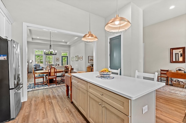 8 Perny Ct, Cape Charles, VA 23310 - kitchen featuring freestanding refrigerator, light wood-style flooring, a kitchen island, and an inviting chandelier