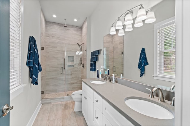 8 Perny Ct, Cape Charles, VA 23310 - bathroom with a wealth of natural light, a stall shower, and a sink