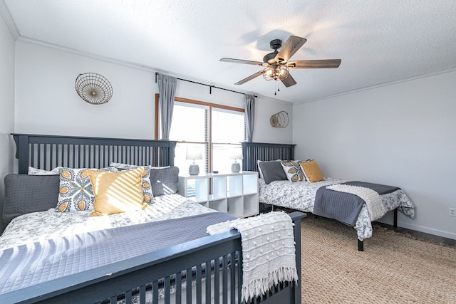 carpeted bedroom with a textured ceiling and ceiling fan