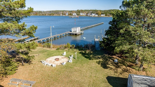 view of dock featuring a water view and an outdoor fire pit