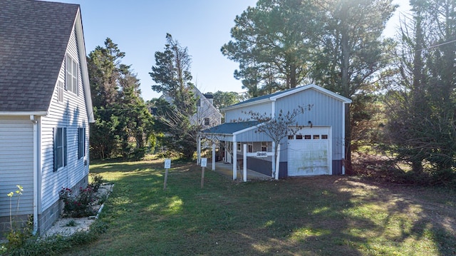 view of yard with an outbuilding and a garage