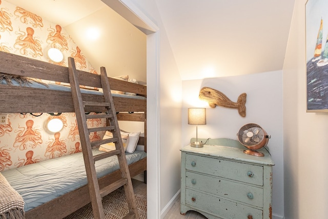 bedroom with lofted ceiling