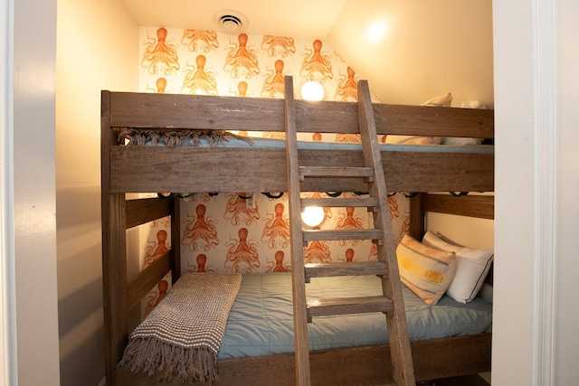 bedroom featuring lofted ceiling