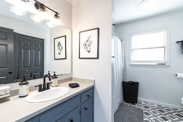 bathroom featuring tile patterned floors, a textured ceiling, vanity, crown molding, and toilet