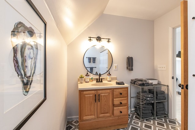 bathroom featuring vanity and vaulted ceiling