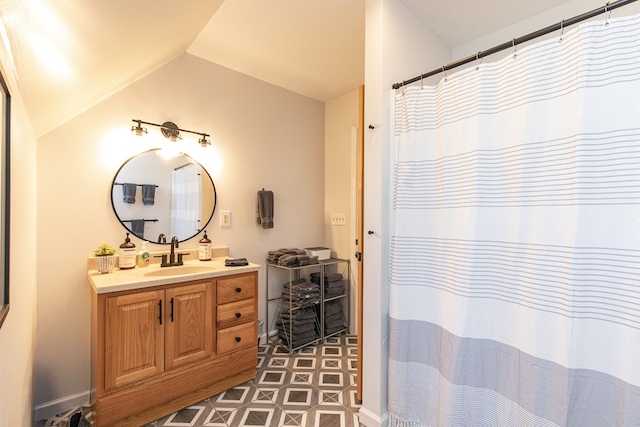 bathroom with vanity and vaulted ceiling