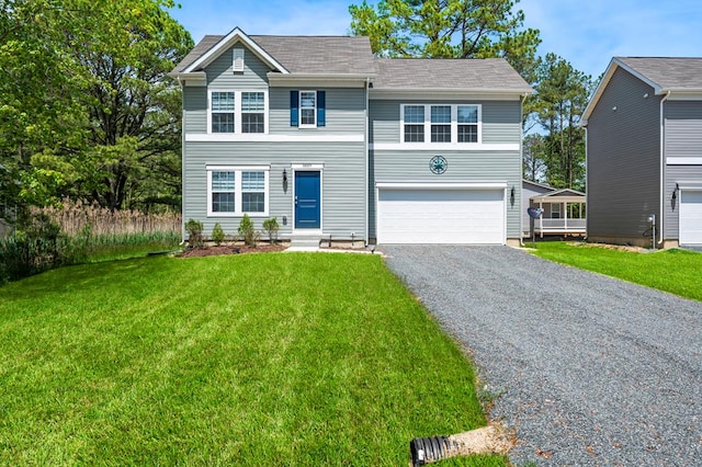 view of front of home featuring a garage and a front yard