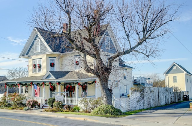 victorian-style house featuring covered porch