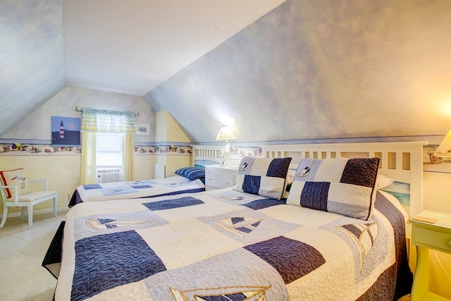 carpeted bedroom with lofted ceiling