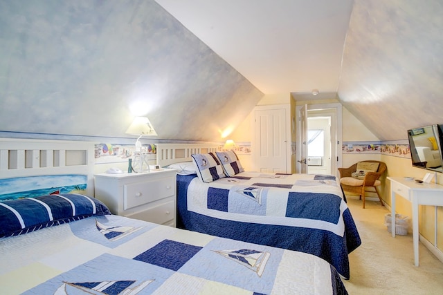 carpeted bedroom with lofted ceiling