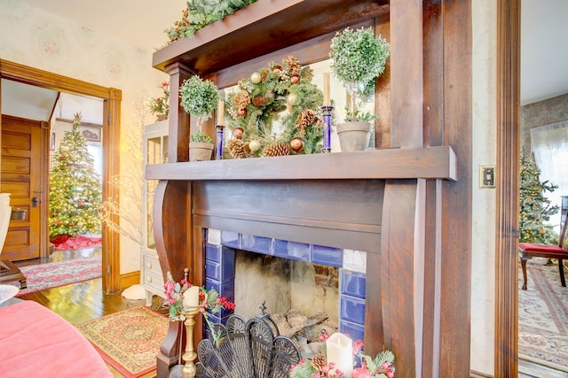 interior details with a fireplace and hardwood / wood-style floors