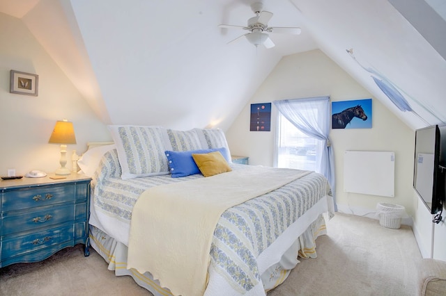 carpeted bedroom featuring ceiling fan and vaulted ceiling