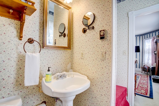 bathroom featuring toilet and sink