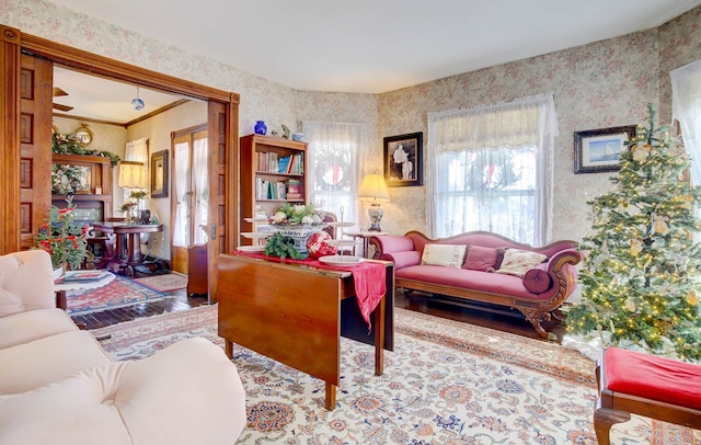 living room featuring hardwood / wood-style flooring and crown molding