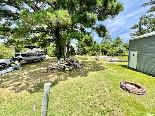 view of yard featuring a fire pit