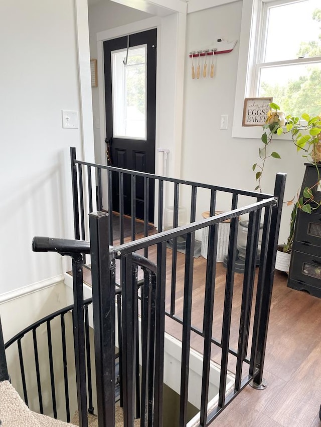 stairs featuring wood-type flooring