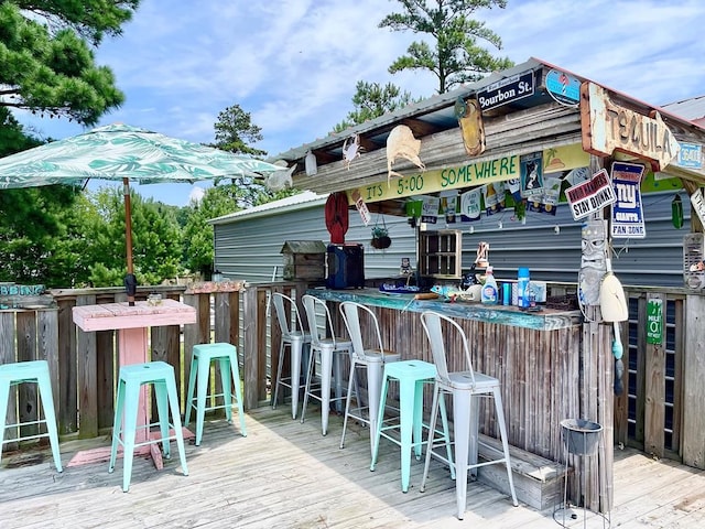 wooden terrace featuring an outdoor bar