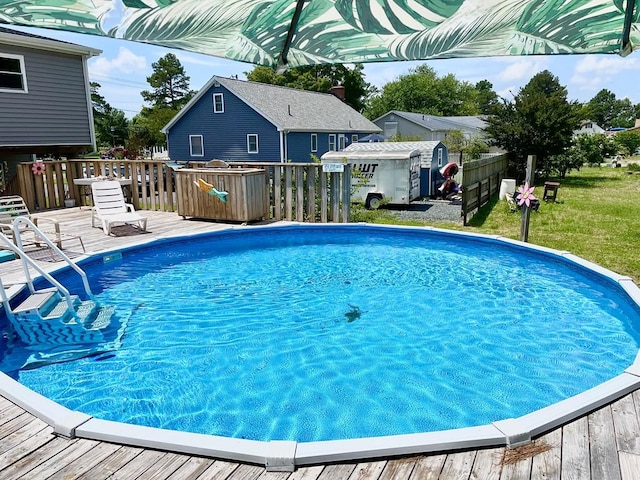 view of swimming pool with a wooden deck