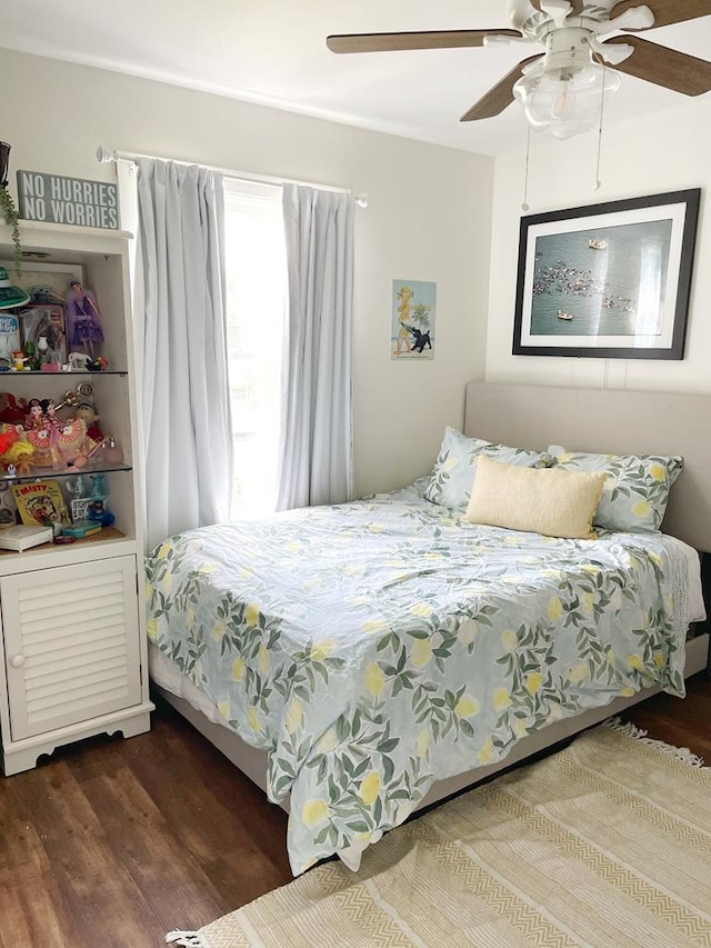 bedroom with ceiling fan and wood finished floors