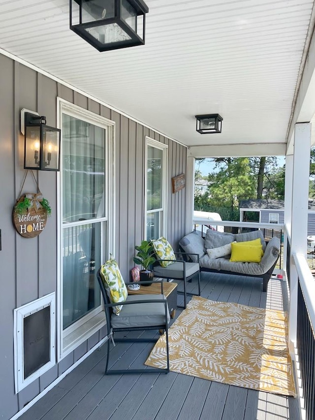 wooden deck with outdoor lounge area