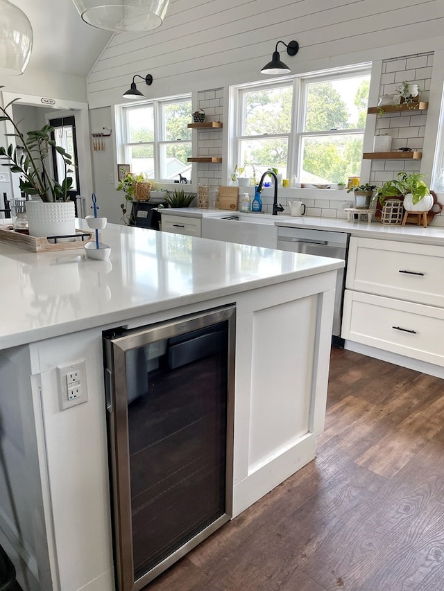 kitchen featuring open shelves, stainless steel dishwasher, dark wood finished floors, wine cooler, and decorative backsplash