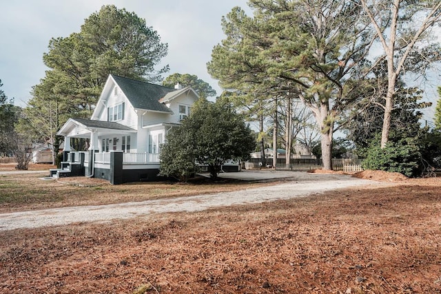 view of home's exterior featuring a wooden deck